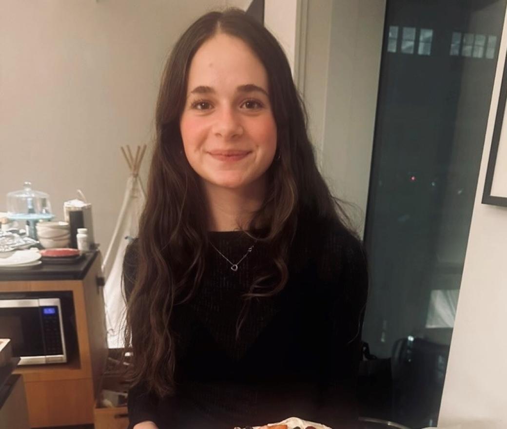 Image of young woman looking at camera