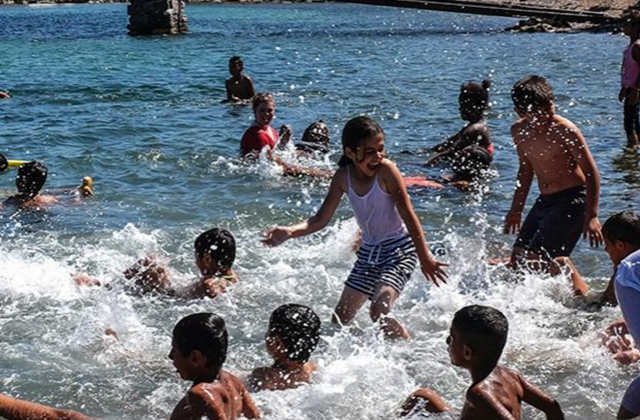Refugee children at a swimming lesson.